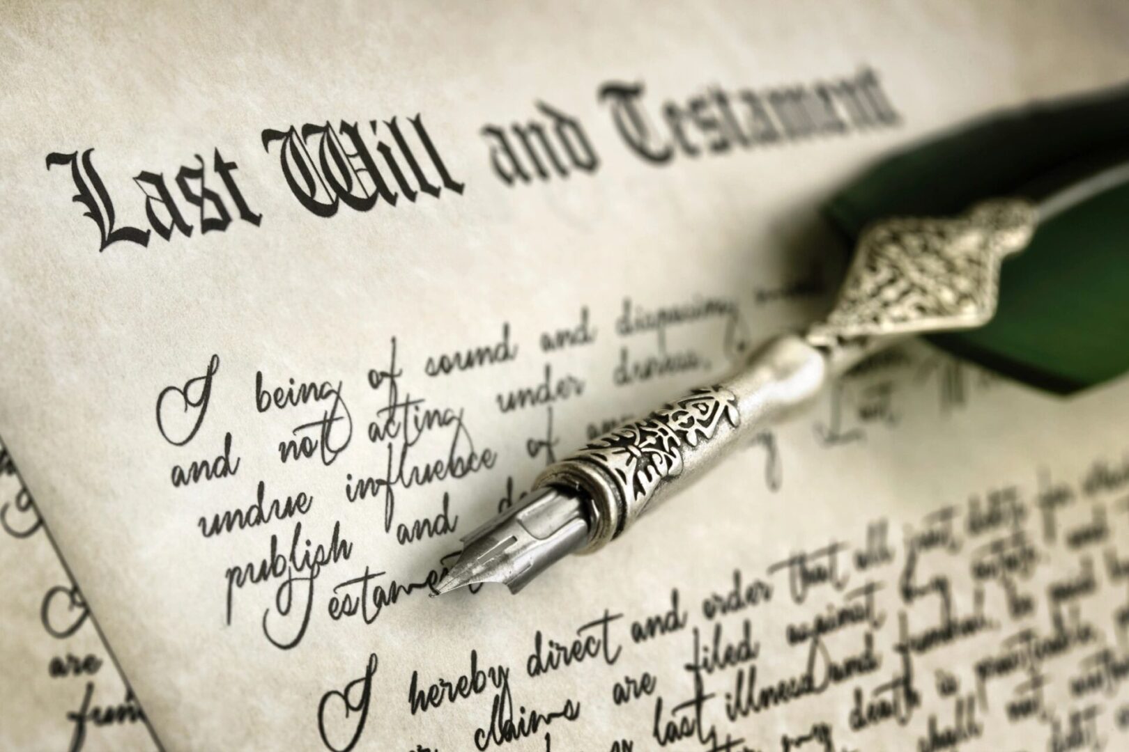 A pen and paper on top of a will.